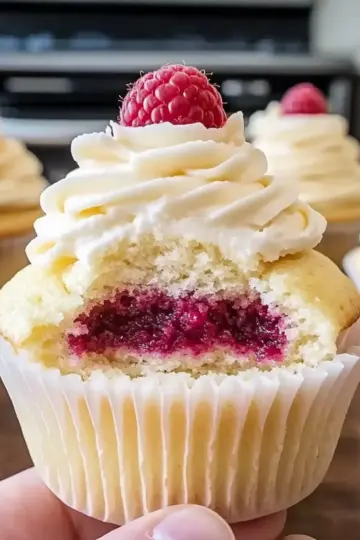 Almond Wedding Cake Cupcakes with Raspberry Filling